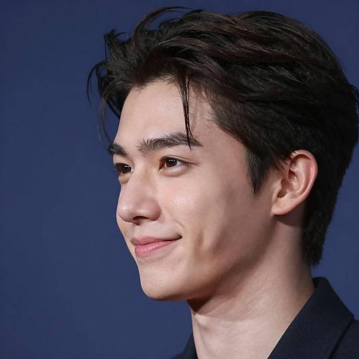 Young Man in Profile with Blue Background