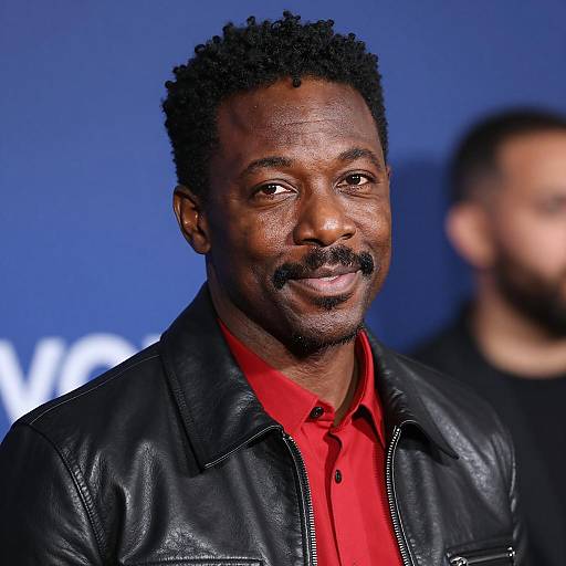 Smiling Black Man in Leather Jacket