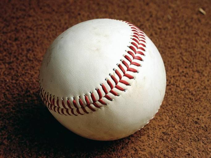 Close-up of Baseball on Brown Surface