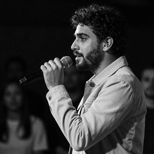 Dimly Lit Profile of a Male Singer