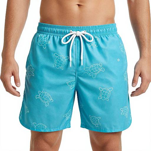 Photograph of a man's torso wearing bright blue, turtle-print swim shorts with white drawstring, against a white background.