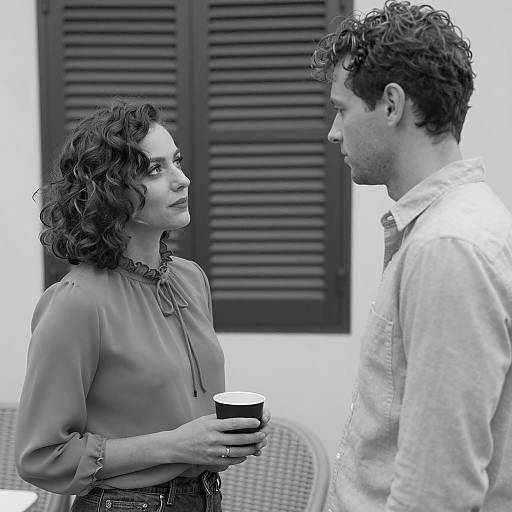 Black and White Portrait of Two People Facing Each Other