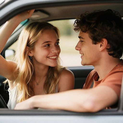 Young Couple Smiling in Car