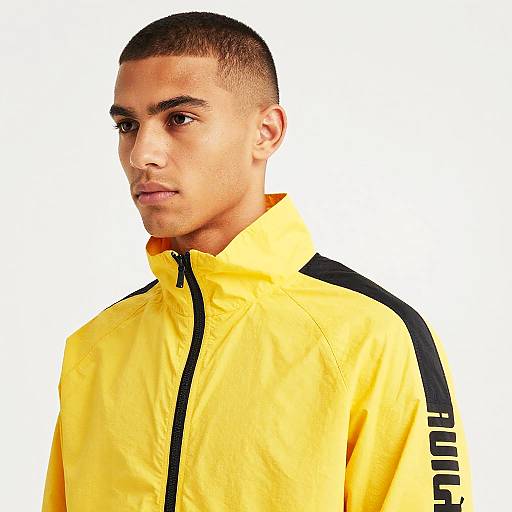 Portrait of Young Man in Yellow Puma Jacket