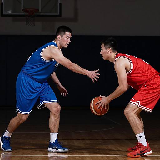 Intense Basketball Duel in Shadows