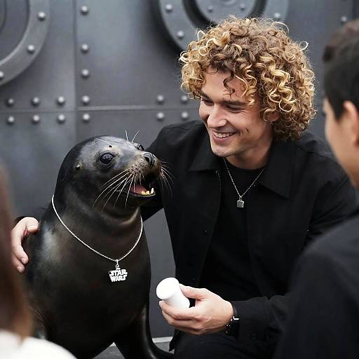 Man Smiling at Seal with Star Wars Necklace