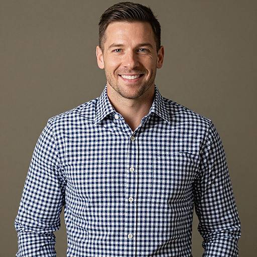Smiling Man in Stylish Plaid Shirt