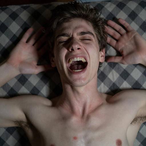 Screaming young man lying down