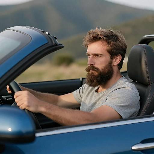 Bearded Man Driving Blue Convertible