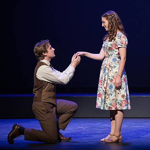 Gentleman Kneeling to Woman at Theater