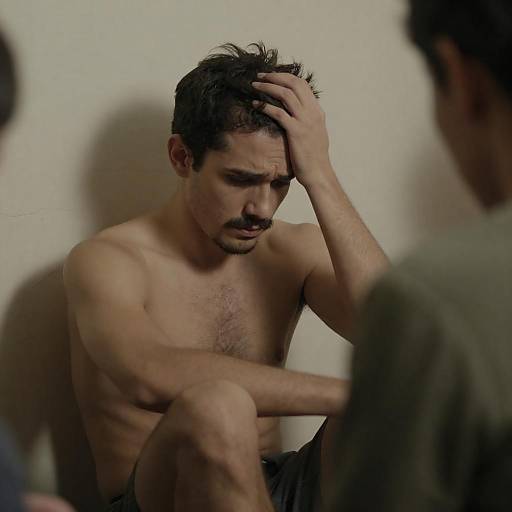 Distressed Man in Dimly Lit Setting