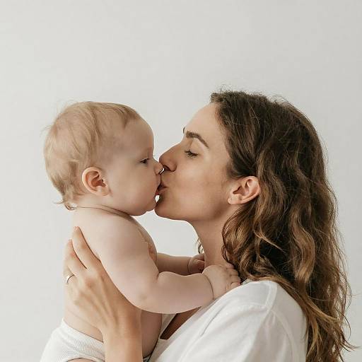 Tender Moment: Woman Kissing Baby