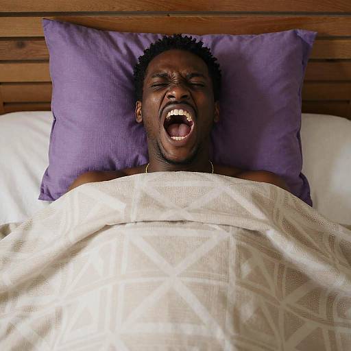 Yawning Black Man in Bed