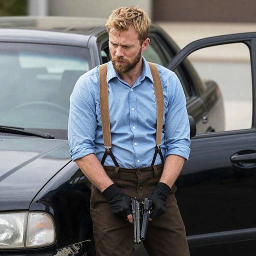 Determined Man with Handguns in Urban Setting