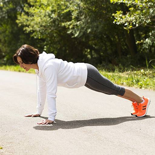Woman Exercising Outdoors Push-Up