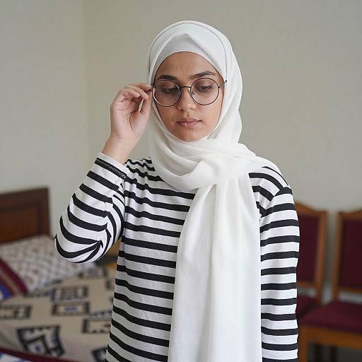 Young Woman Adjusting White Hijab