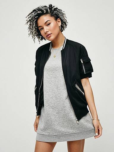 Young Woman in Grey Dress and Black Bomber Jacket