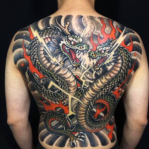 Photograph of a muscular man's back, featuring a vibrant, detailed dragon tattoo with black scales, red flames, and sharp yellow lightning.