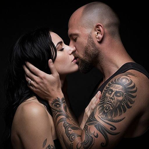 Intimate Tattooed Couple Kiss