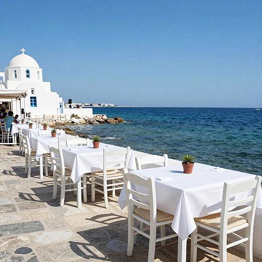 Seaside Restaurant with White Chairs and Tables