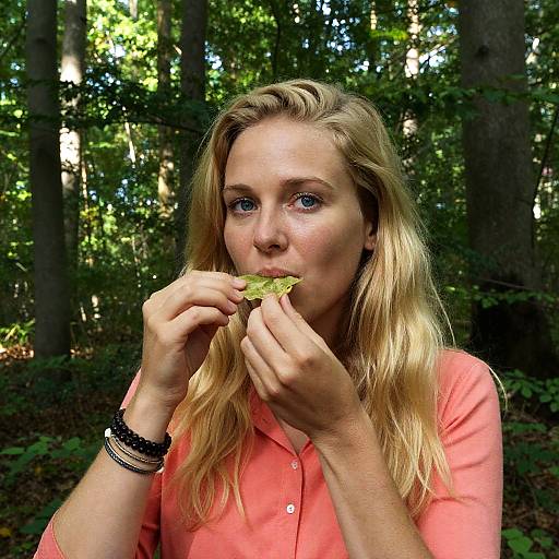 Blonde Woman Enjoying a Snack in Nature