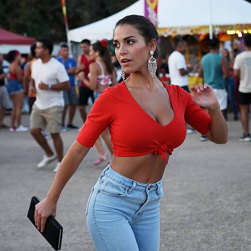 Photograph of a curvy woman with tan skin, dark hair in a bun, wearing a red crop top, light blue high-waisted jeans