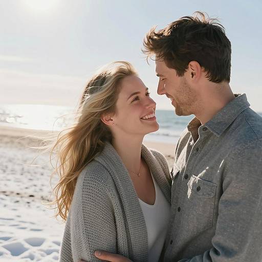Joyful Couple Embracing a Snowy Beach