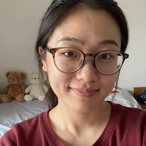 Woman Wearing Glasses Smiling Indoors