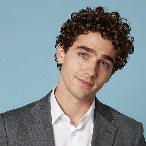 Young Man with Curly Hair in Gray Suit