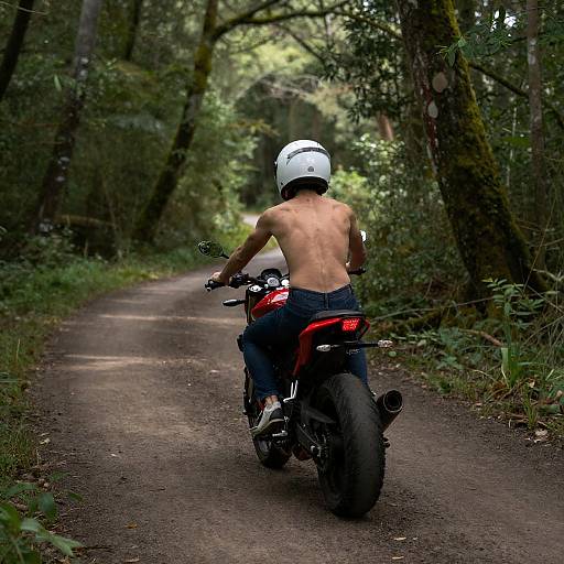 Naked Rider on Red Motorcycle in Forest