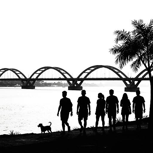 Silhouetted Shoreline Walk with Bridge