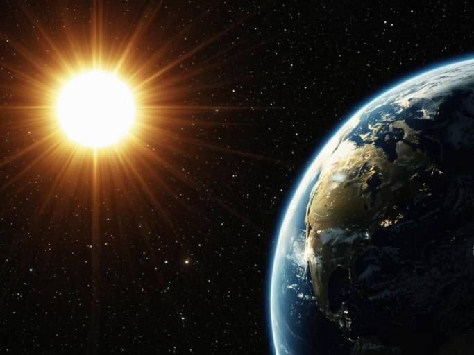 Close-Up Earth and Sun Wallpaper