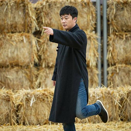 Dynamic Portrait of Asian Man in Hayfield