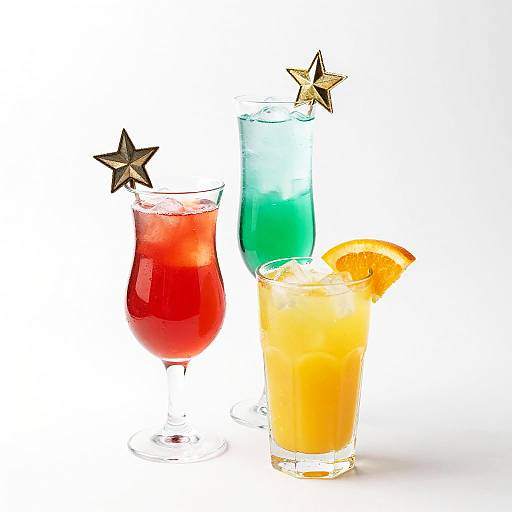 Photograph of three colorful cocktails: red with star garnish, blue-green, and orange with orange slice, each in a glass, white background.