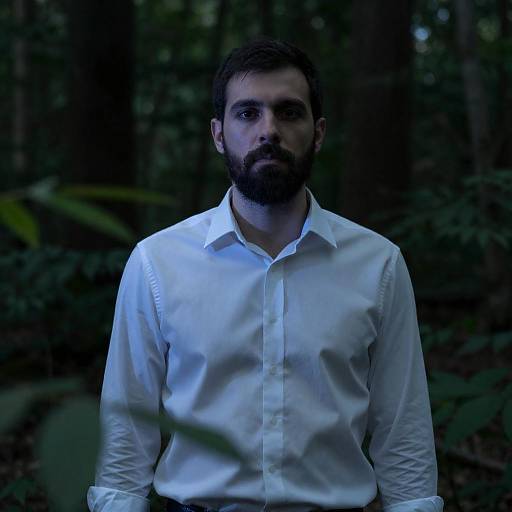 Blue-Lit Bearded Man in Dark Forest