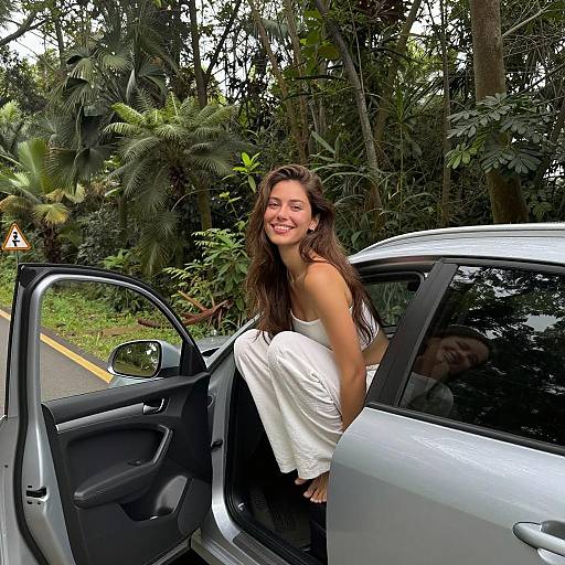Joyful Woman Sitting on Silver Car