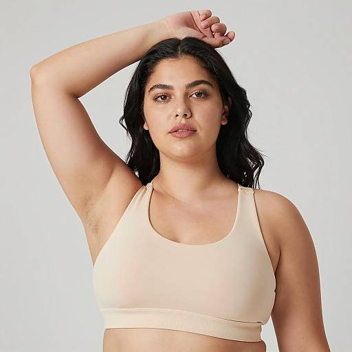 Plus-Size Woman in Beige Sports Bra