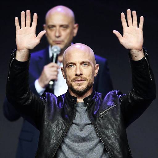 Focused Bald Man in Leather Jacket