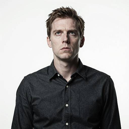 Man with Intense Gaze Against White Background