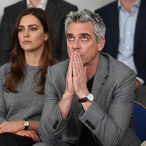 Pensive Man in Gray Suit with Woman in Gray Sweater