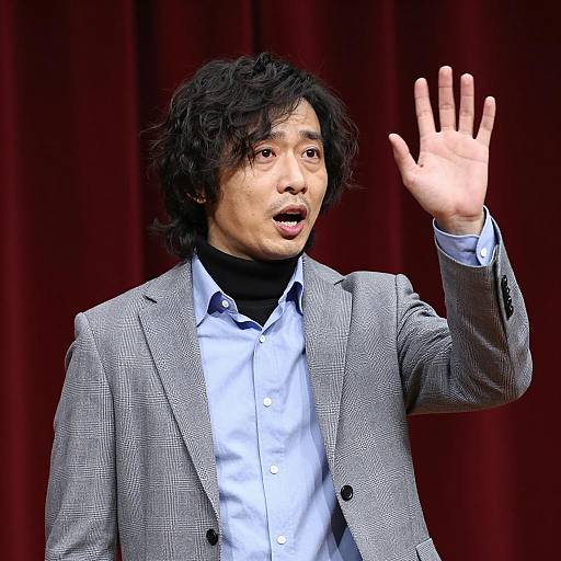 Expressive Man in Checkered Jacket Photo