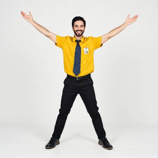 Happy young man in yellow shirt with outstretched arms
