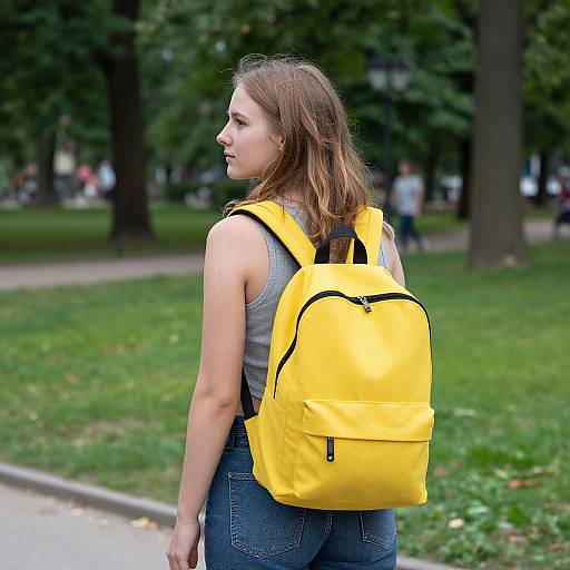Young Woman with Yellow Backpack in Berlin Park