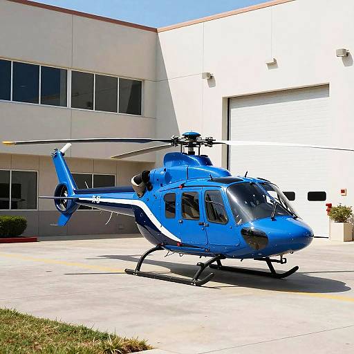 Blue Helicopter on Concrete Lot