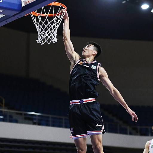 Athletic Male Basketball Slam Dunk