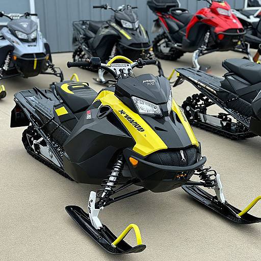 Photograph of a black and yellow snowmobile with 