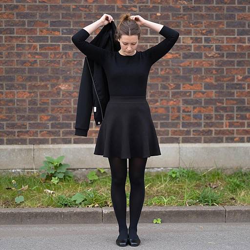 Elegant Woman Posing on Urban Pavement