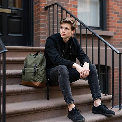 Young Man Sitting on Brick Steps