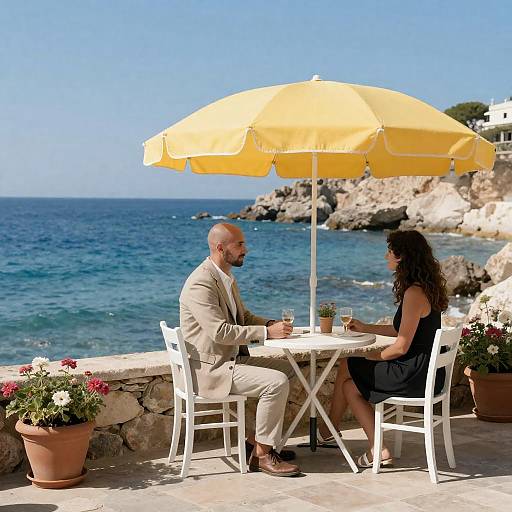 Man in Beige Suit at Seaside Café