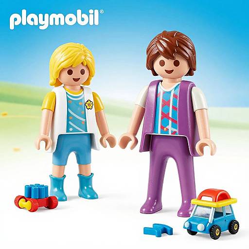 Photograph of two LEGO minifigures: blonde boy in yellow shirt, blue shorts, blue boots; brown-haired boy in purple vest, red